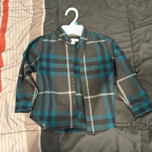 A Burberry boy button down shirt.